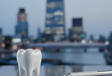 A close-up, photorealistic image of a pristine, healthy human molar tooth in the foreground. A sterile silver dental instrument, like a fine probe, is gently positioned near the tooth. The background is an extremely blurred, out-of-focus cityscape of a modern UK city, with abstract building shapes and soft light. The overall scene conveys precision, professionalism, and dental care in the UK.