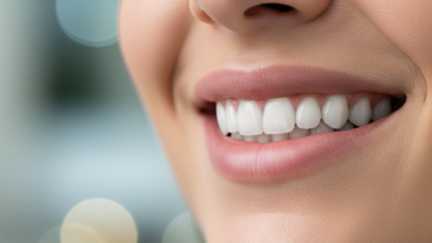 Close-up of a person's lower face with a confident, natural, and healthy smile, featuring clean, strong teeth. The background is softly blurred, suggesting a professional and calming environment, conveying successful dental implant recovery.