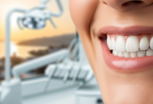 Close-up of a person's brilliant, perfectly aligned white teeth, showcasing a confident 'Hollywood Smile,' with a very blurred background suggesting a modern dental clinic and a warm, sun-drenched Turkish landscape.