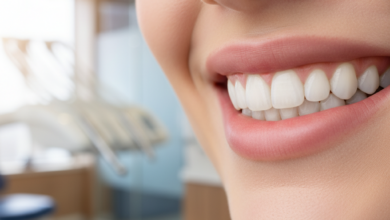 Close-up of a person with a radiant, confident, and perfect smile, showcasing beautifully white and evenly aligned teeth, with a subtly blurred background of a modern dental clinic interior.