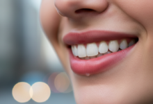 Close-up of a person's mouth, showcasing a perfectly healthy, naturally white and bright smile with gently curved lips, against a softly blurred, abstract background hinting at an urban UK setting.